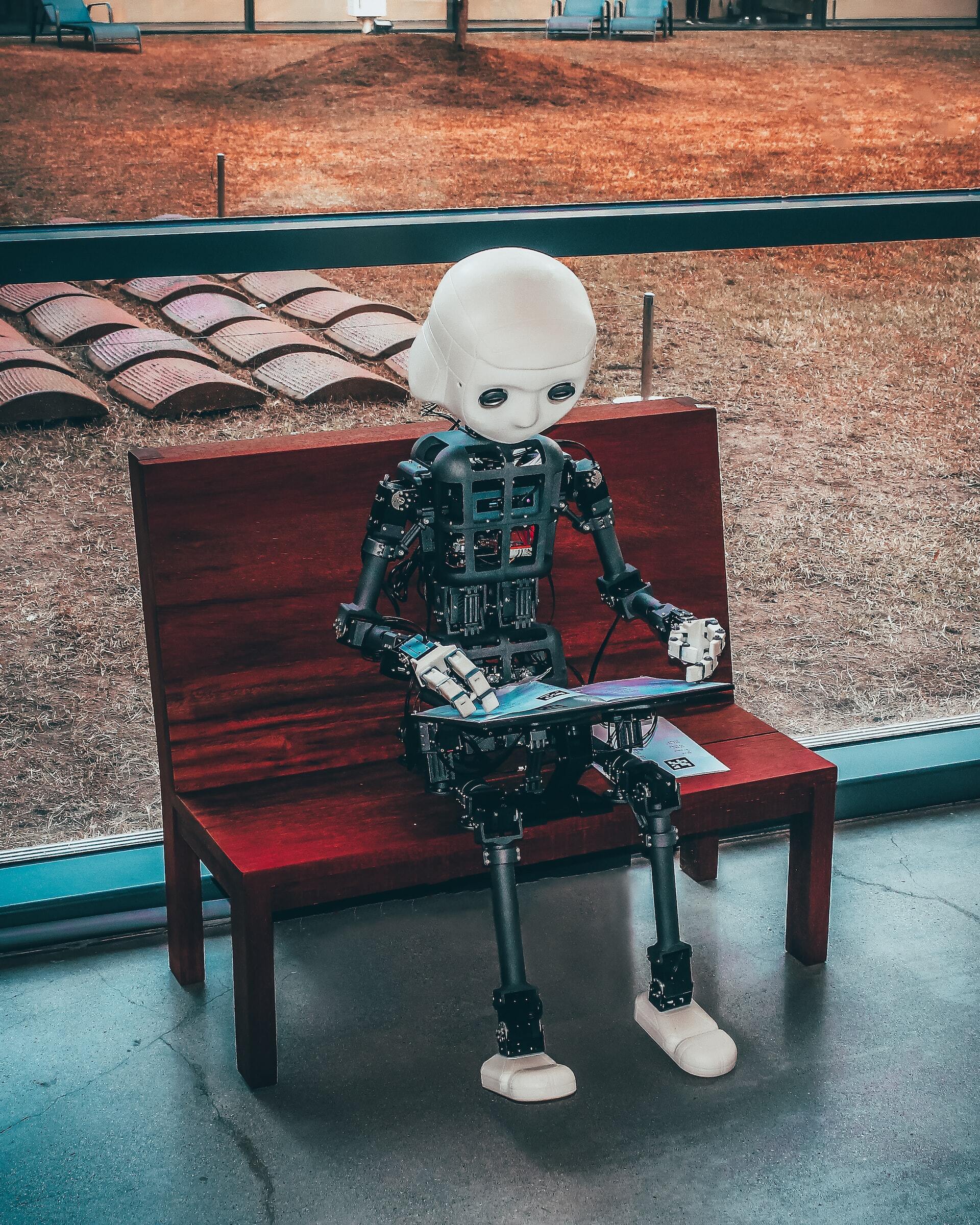 Robot working on a laptop
